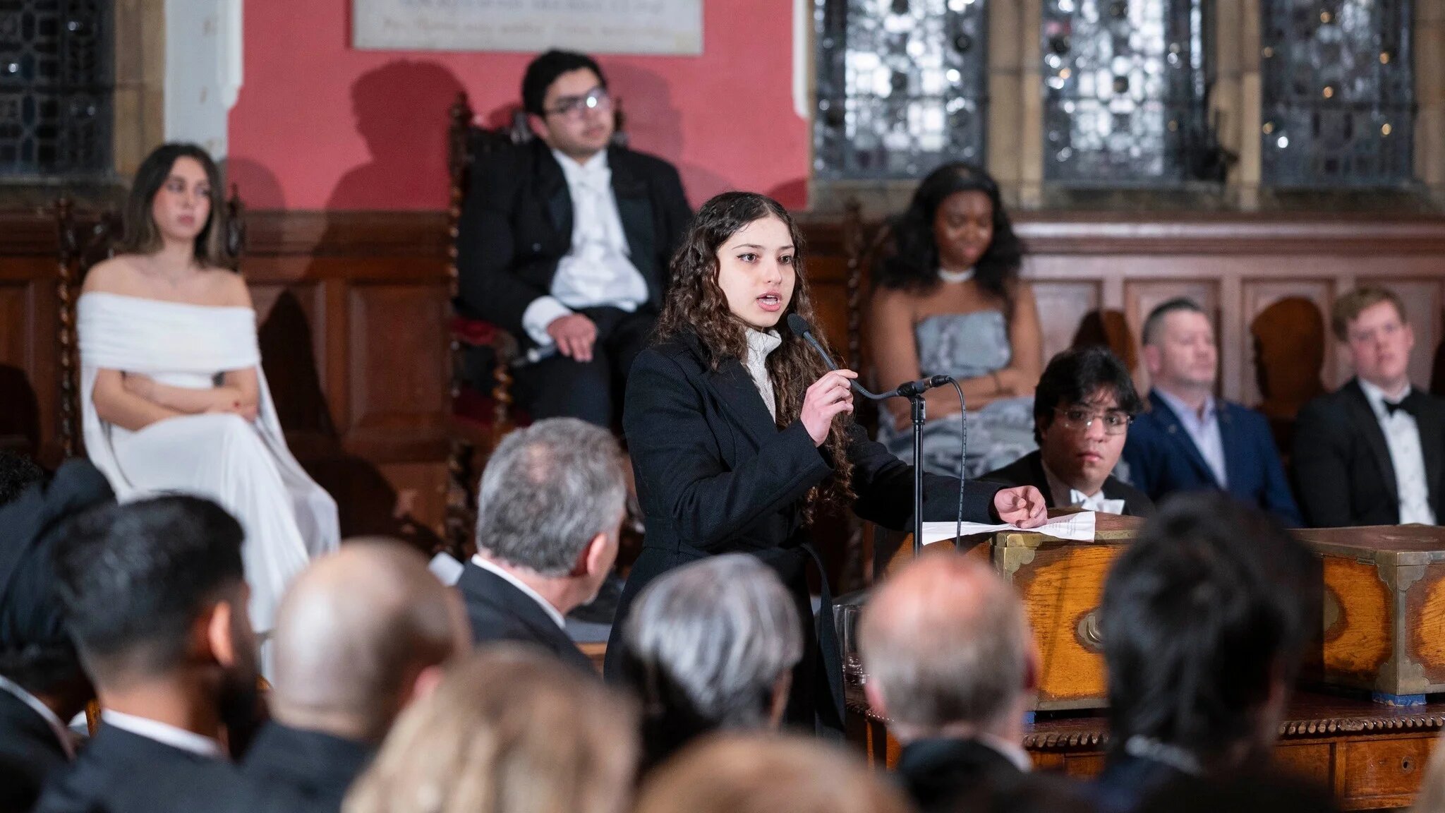 Arwa Hanin Elrayess (C) can be seen speaking at a debate at the prestigious Oxford Union (Courtesy)