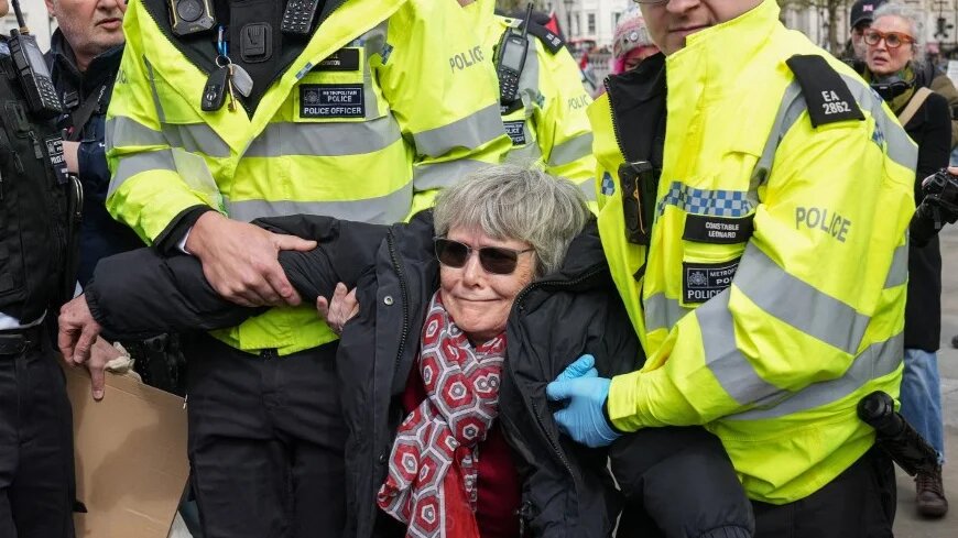 Police carry away a protester as people gather to call for the lifting of a ban on Palestine Action, in London’s Trafalgar Square on 11 April 2026 (Carlos Jasso/AFP)