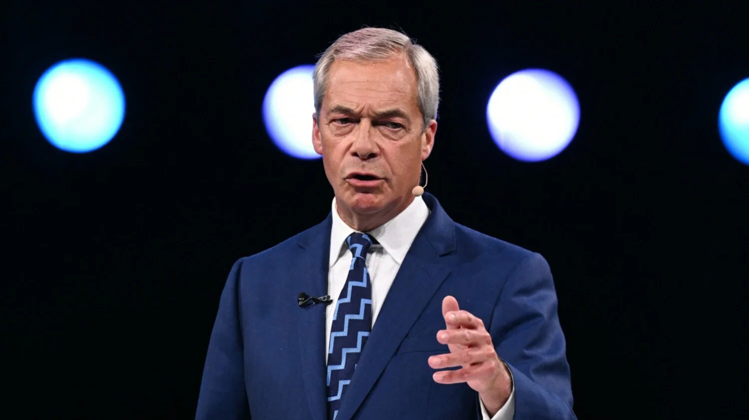 Reform UK leader Nigel Farage opens the party's annual conference in Birmingham on 5 September 2025 (AFP)
