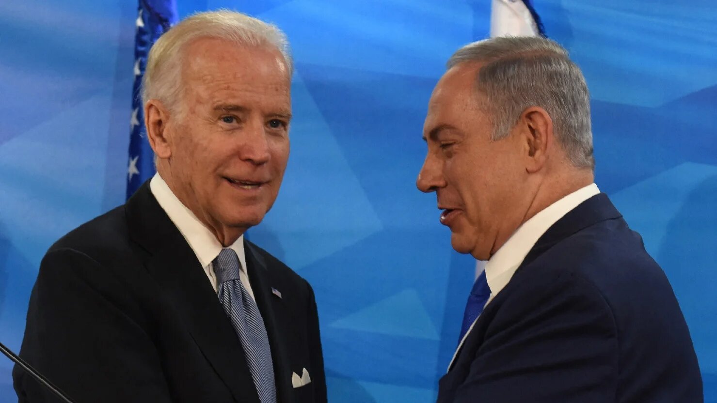 Then-US Vice President Joe Biden and Israeli Prime Minister Benjamin Netanyahu shake hands after giving joint statements in the prime minister's office on 9 March 2016.