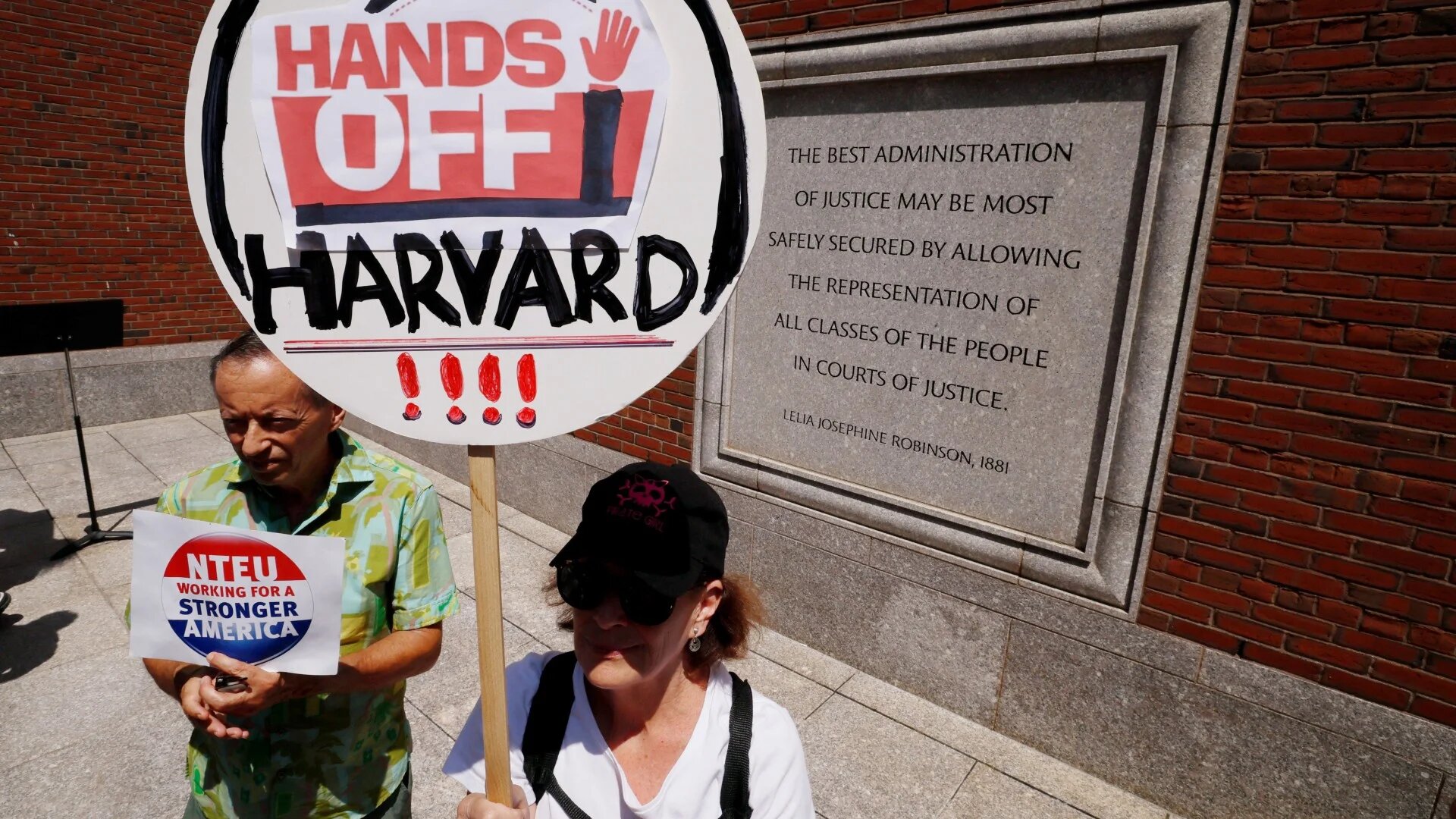 Demonstrators gather in Boston on 21 July 2025 to support Harvard University during its hearing before a federal judge to order US President Donald Trump's administration to restore cancelled federal grants (Brian Snyder/Reuters)