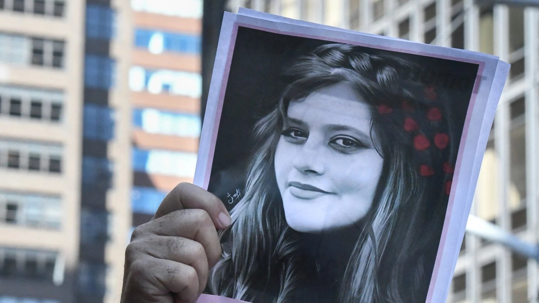 People participate in a protest against Iranian President Ebrahim Raisi outside of the United Nations on 21 September, 2022 in New York City (AFP)