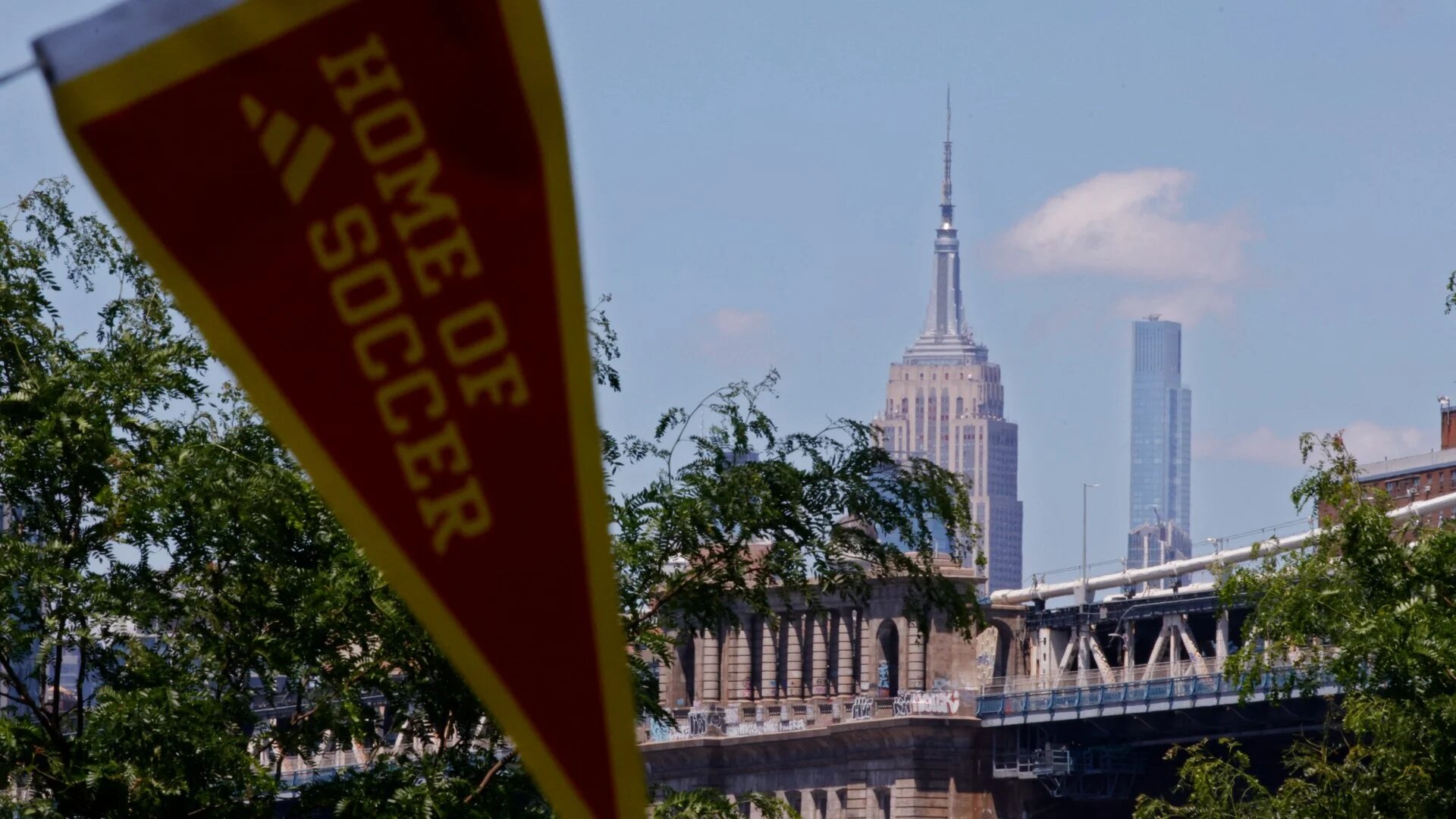 A view of the Empire State Building as people arrive ahead of a watch party at a Fifa Fan Zone in the Brooklyn borough of New York City, on 13 June 2026 (Leonardo Munoz/AFP)