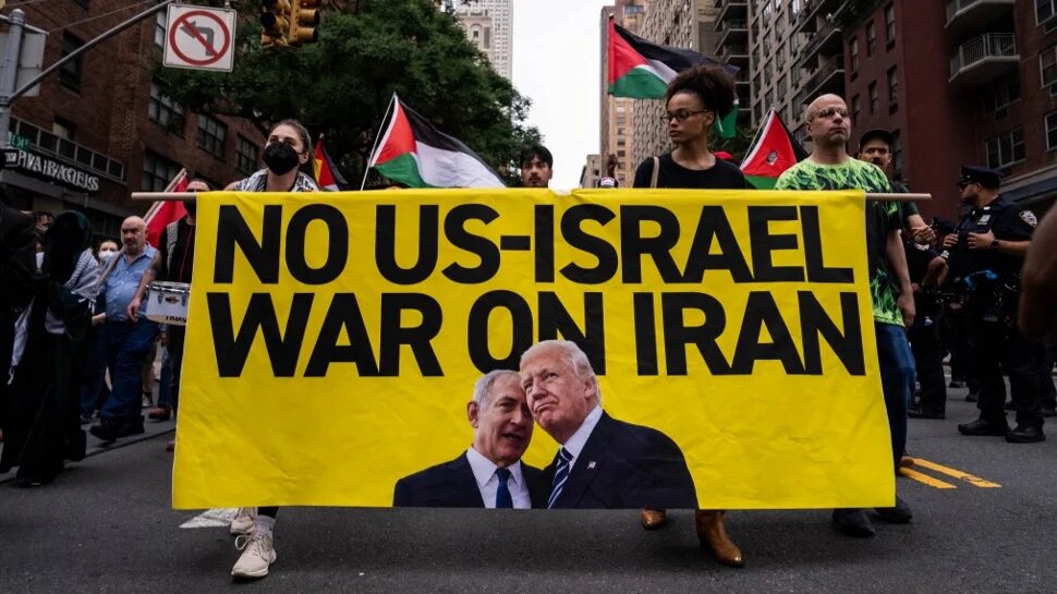 Protesters in New York City urge the Trump administration not to join Israel’s war on Iran, on 18 June 2025 (Adam Gray/Getty Images/AFP)