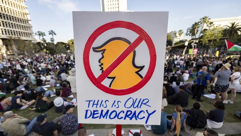 Protesters gather in downtown Los Angeles on 5 April 2025 (Etienne Laurent/AFP)