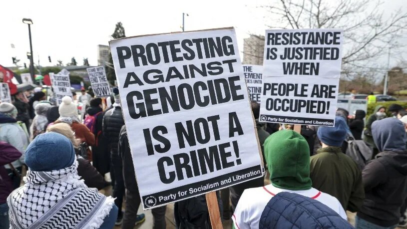 People protest the arrest of activist Mahmoud Khalil at the University of Washington campus in Seattle, Washington, on 15 March 2025 (Jason Redmond/AFP)