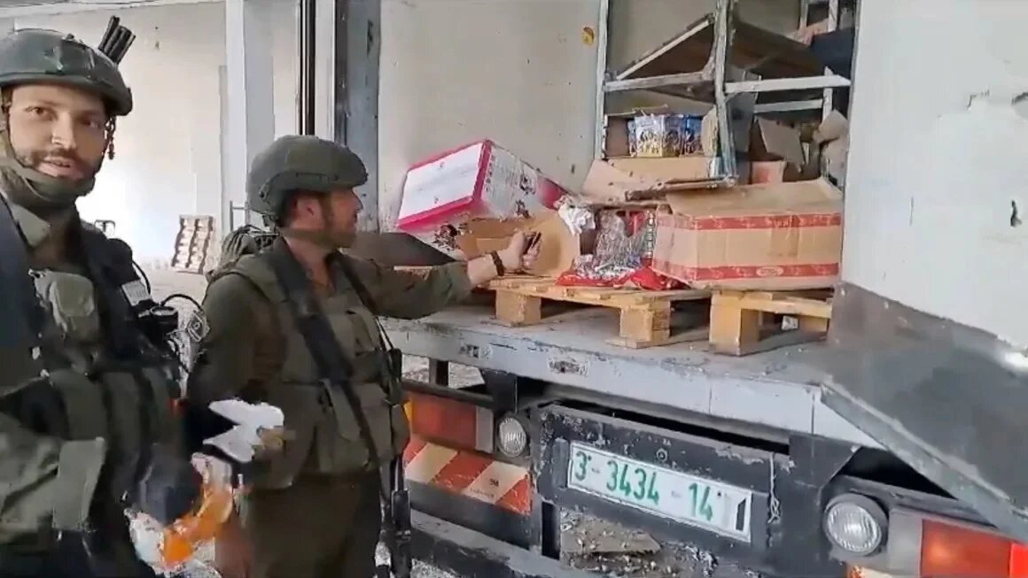 Footage shared on social media shows Israeli soldiers setting fire to scare food and water supplies in the Gaza Strip (X/Screengrab)