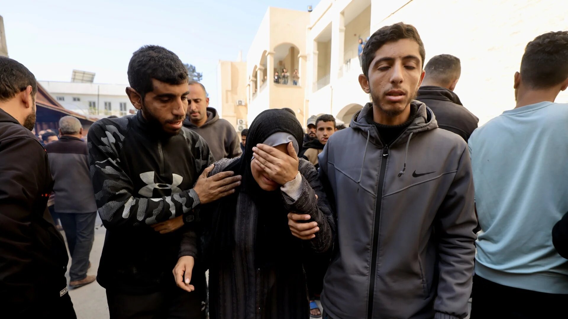 Palestinians mourn outside Gaza's al-Shifa hosptial after an Israeli attack kills hundreds (MEE/Mohammed al-Hajjar)