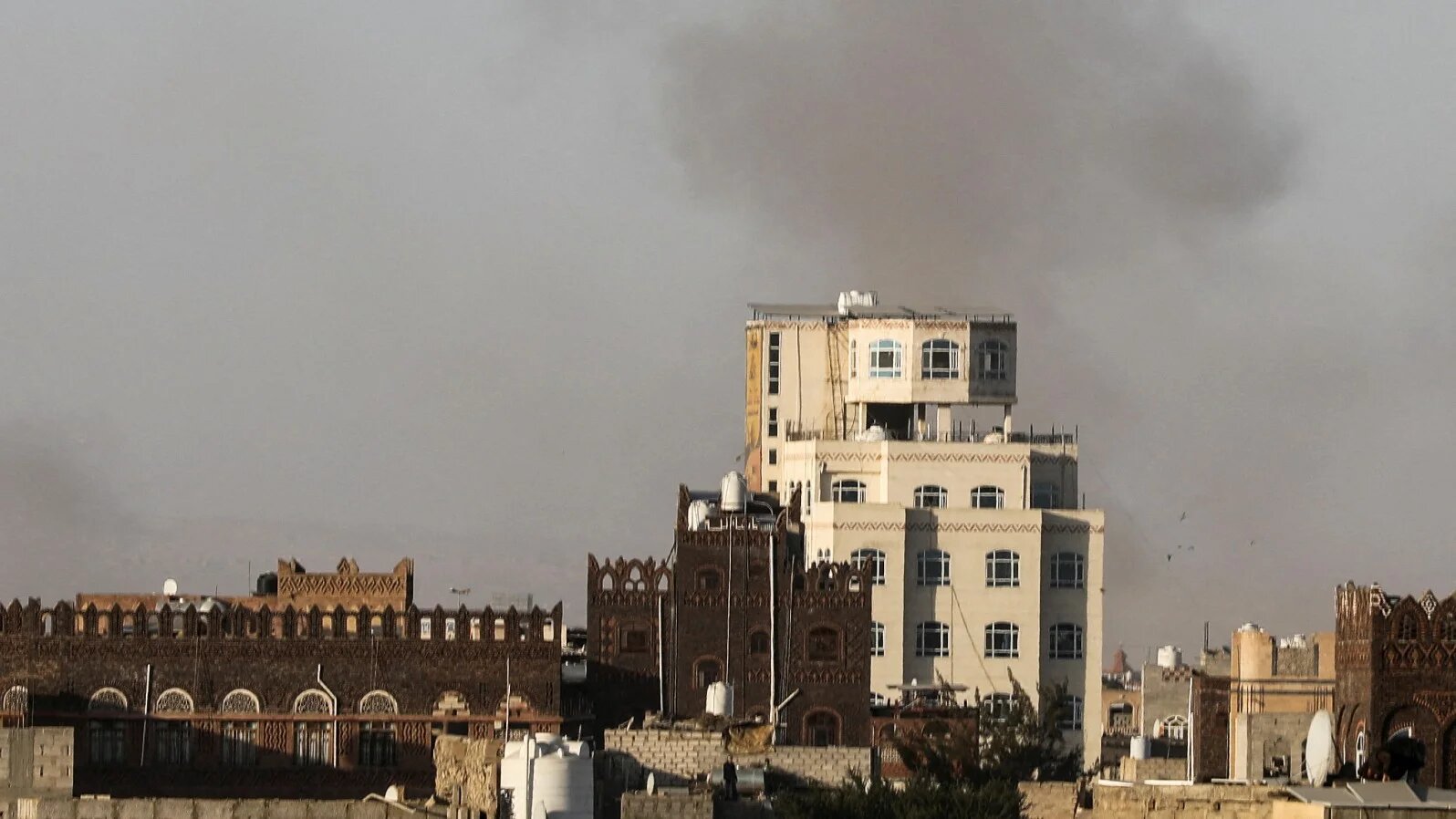 Smoke rises after Israeli strikes near the airport in Sanaa, Yemen, on 26 December 2024 (Reuters)