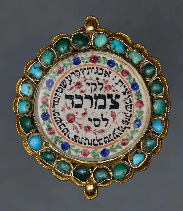 Amulet, Iran, ca. 1900. Gold, glass, turquoise, ink, and paint on paper (Gross Family Collection)