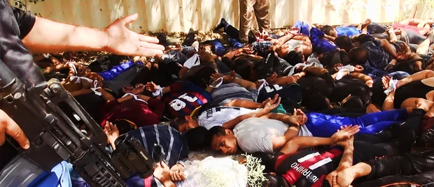 ISIL post pictures of mass executions (AFP/ HO/WELAYAT SALAHUDDIN)
