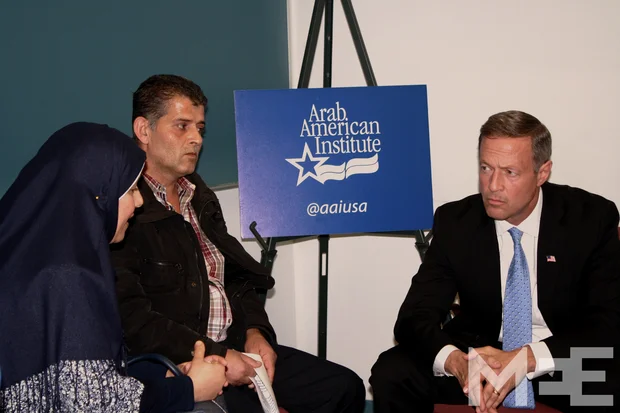 Presidential candidate Martin O'Malley listens to Syrian refugee Moustafa Assad before his speech at the University of Michigan-Dearborn (MEE/Merinda Valley)