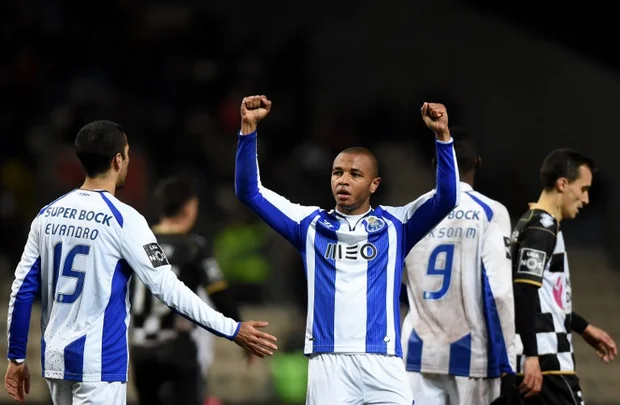 Porto's Algerian midfielder Yacine Brahimi (C) celebrates after scoring a goal during the Portuguese league football match in Porto on 23 February (AFP)