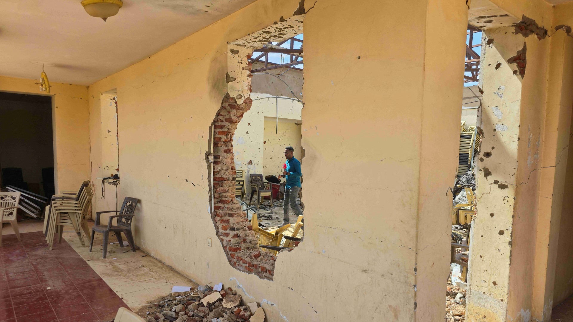 This photograph shows damaged interiors of a Sudanese lawyers' syndicate after it was reportedly targeted by the Rapid Support Forces (RSF) in el-Obeid on 27 July 2026 (AFP)