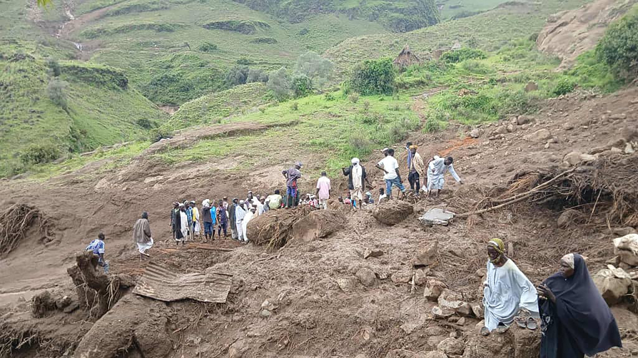 Men gather at the site of the landslide on Tarsin in Sudan's Darfur (Sudan People’s Liberation movement/Abdul Wahid faction)
