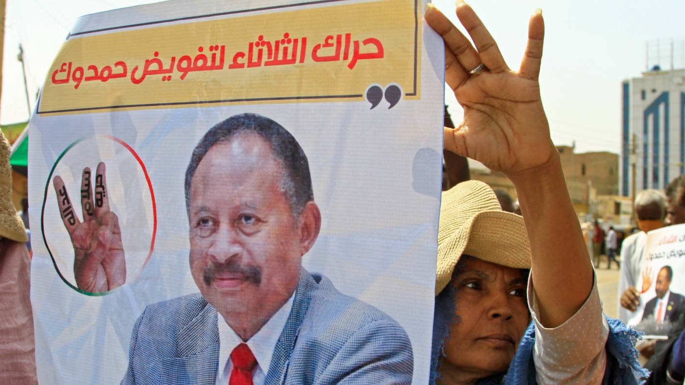Sudanese protesters back the reinstatement of Abdalla Hamdok, the prime minister ousted during a coup, in Khartoum in July 2022 (AFP)