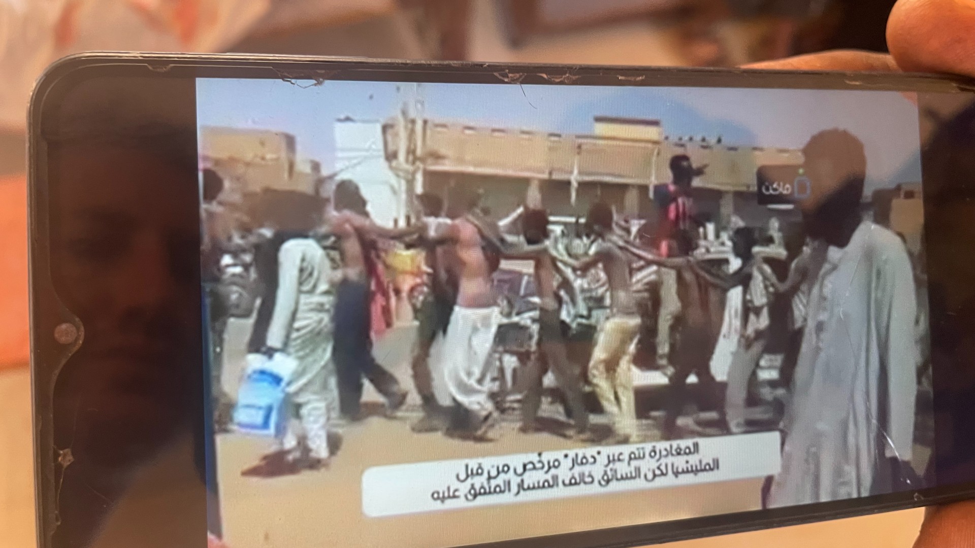 This video shared with MEE shows unarmed civilian men being marched through al-Salha after being forced out of their lorry on the way to Omdurman (Daniel Hilton/MEE)