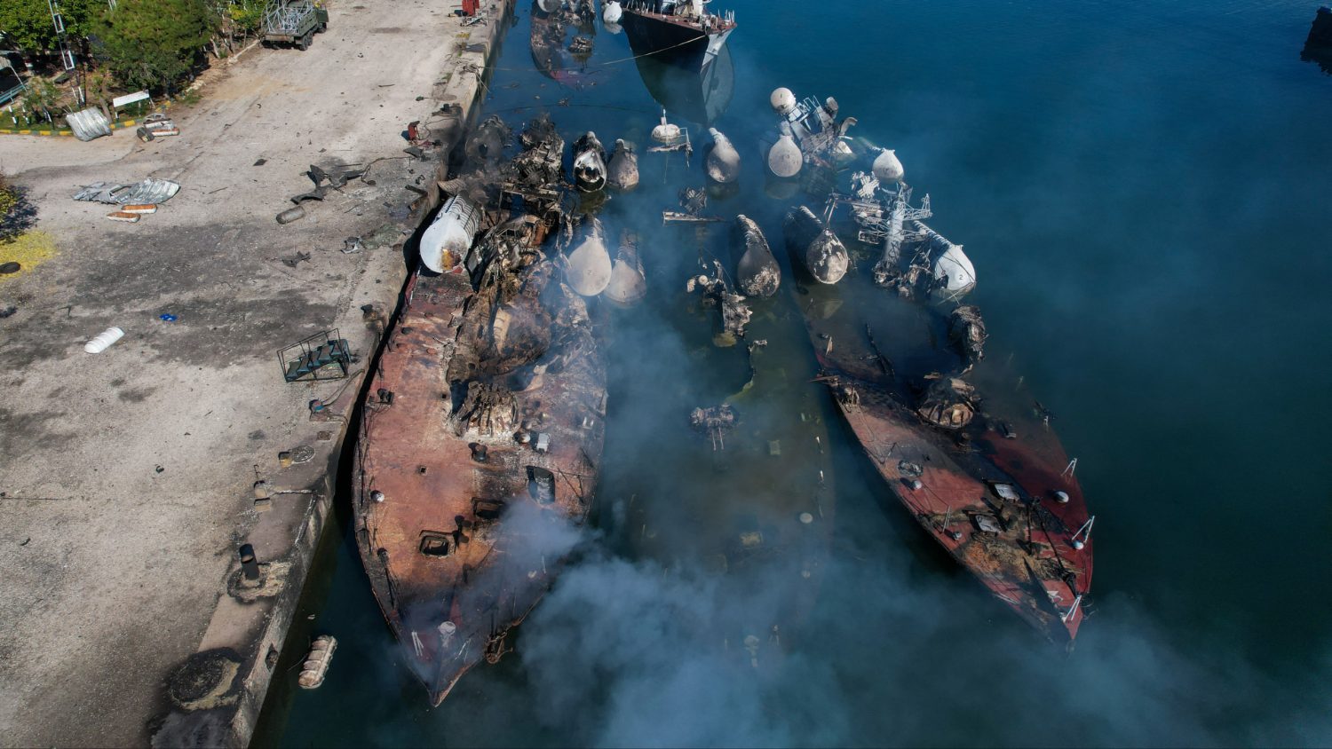 An aerial photo shows Syrian naval ships destroyed during an overnight Israeli attack on the port city of Latakia on 10 December 2024