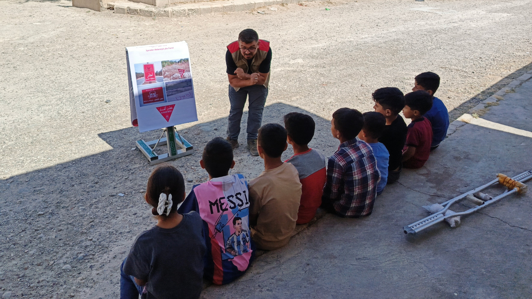 MAG teams give Explosive Ordnance Risk Education sessions to kids in the Sabakh village, in Syria's Raqqa province (Hannah Wallace/MEE)