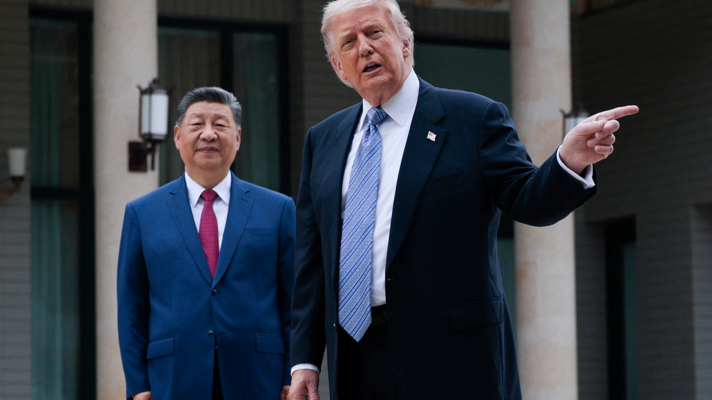 US President Donald Trump and China’s President Xi Jinping visit Zhongnanhai Garden in Beijing on 15 May 2026 (Evan Vucci/AFP)