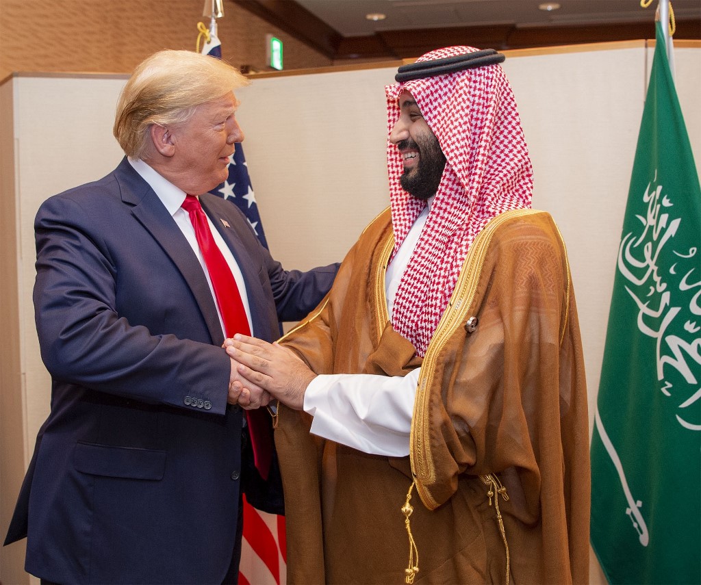 Saudi Crown Prince Mohammed bin Salman shakes hands with US President Donald Trump at the 2019 G20 Summit in Osaka, Japan (Bandar al-Jaloud/Saudi Royal Palace/AFP)