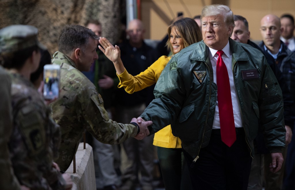 US President Donald Trump on 26 December 2018 at Iraq's Ain al-Assad air base, his first visit to US troops deployed in conflict (AFP/file photo)