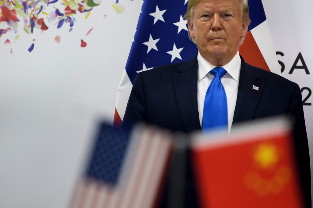 US President Donald Trump attends a meeting on the sidelines of the G20 Summit on 29 June (AFP)