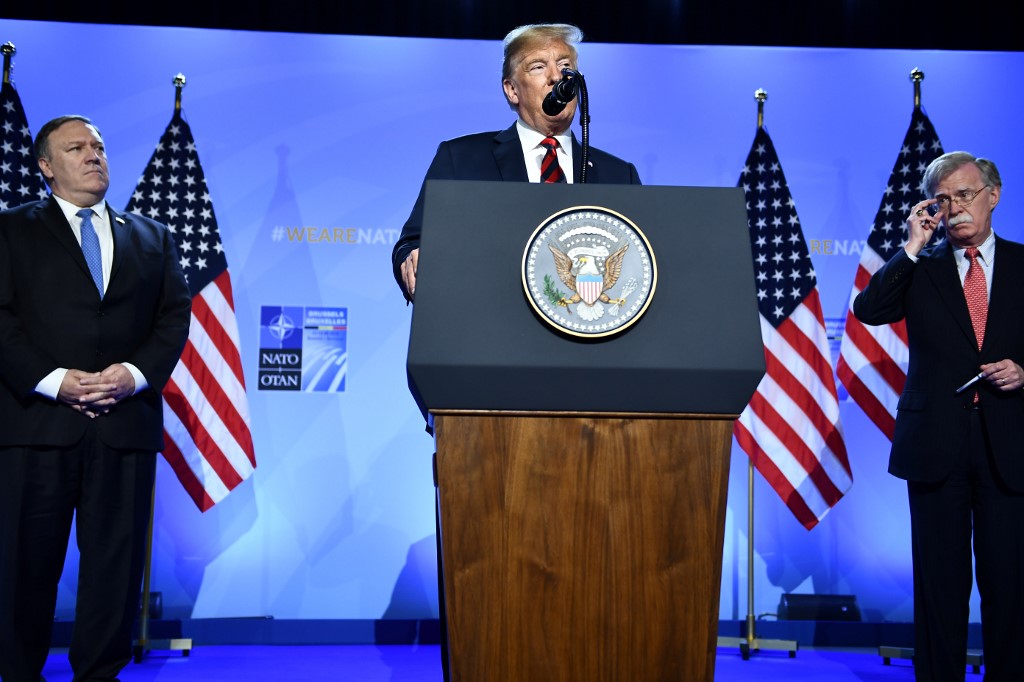 US President Donald Trump, Secretary of State Mike Pompeo and National Security Adviser John Bolton are pictured in Brussels on 12 July 2018 (AFP)