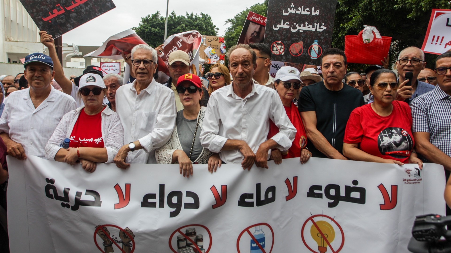 Tunisian protesters gather outside the Ministry of Justice in Tunis on 12 September 2026 to denounce President Kais Saied’s policies whilst carrying a banner saying the country has: 