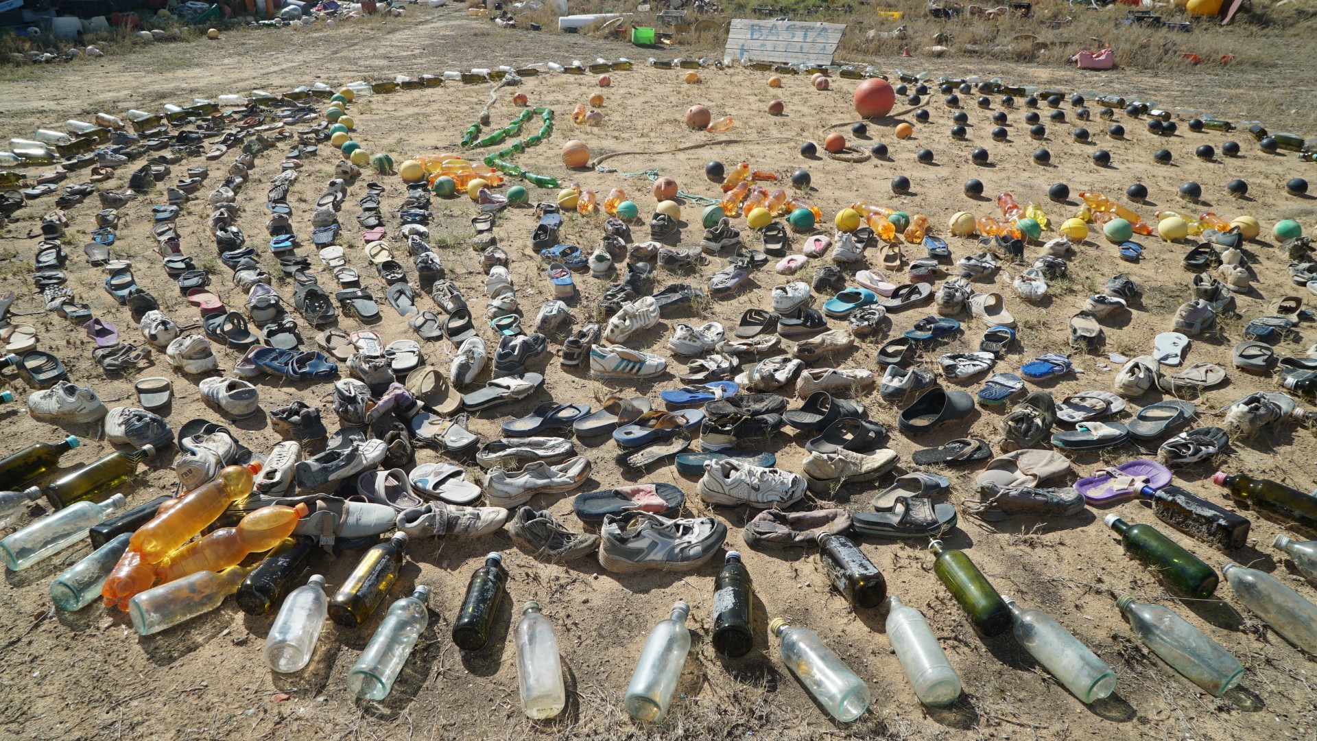 Mohsen Lihidheb, a former post office worker from Zarzis, has created an art installation at his small museum where displays the shoes of migrants who are presumed to have died while crossing to Europe (MEE/Faisal Edroos)