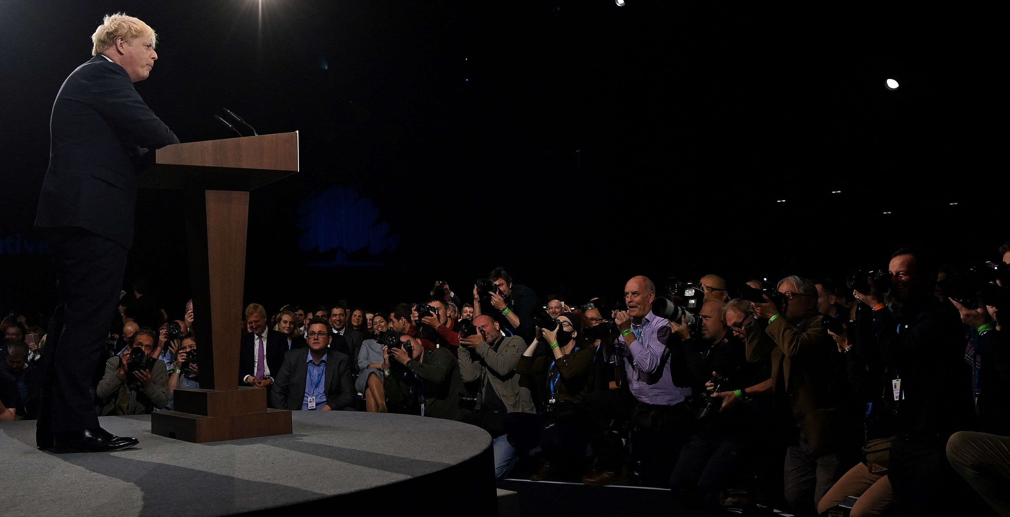 Britain's Prime Minister Boris Johnson delivers his keynote speech on the final day of the annual Conservative Party Conference at the Manchester Central convention centre in Manchester, northwest England, on October 6, 2021