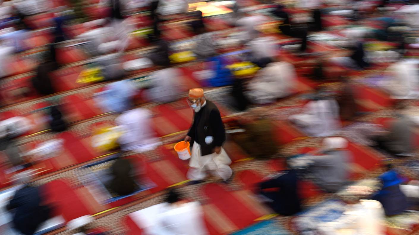 Muslims gather to perform Eid prayer in northern England on 13 May, 2021 (AFP)