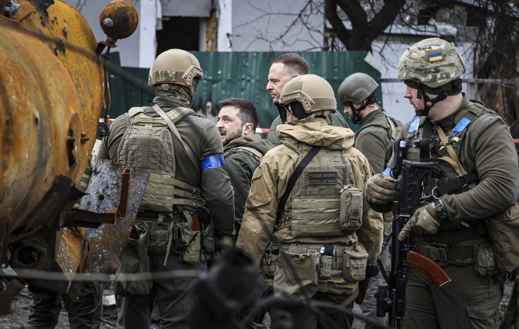 Zelensky stands in the city of Bucha, northwest of Kyiv, on 4 April 2022 (AFP)