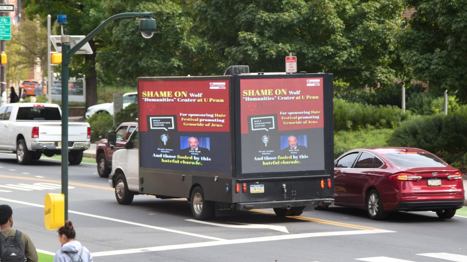 A truck displaying a digital billboard accusing the Palestine Writes festival of being antisemitic.