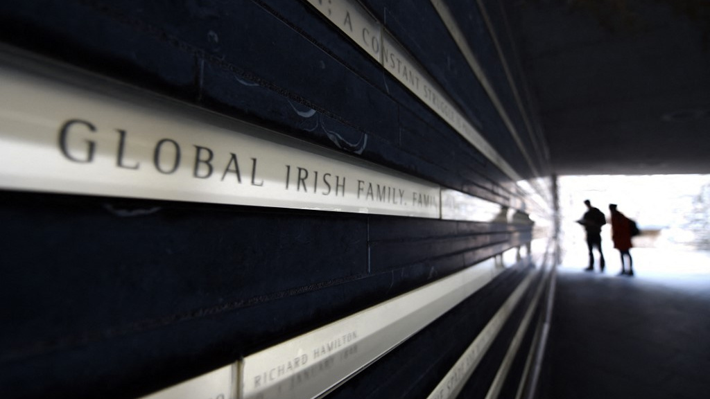 Tourists walk inside the the Irish Hunger Memorial in New York City on 16 March 2015 (Timothy A Clary/AFP)