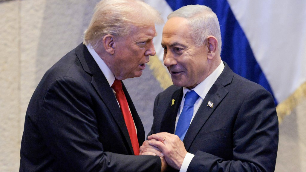 US President Donald Trump speaks with Israeli Prime Minister Benjamin Netanyahu at the Knesset in Jerusalem on 13 October 2025 (Chip Somodevilla/AFP)