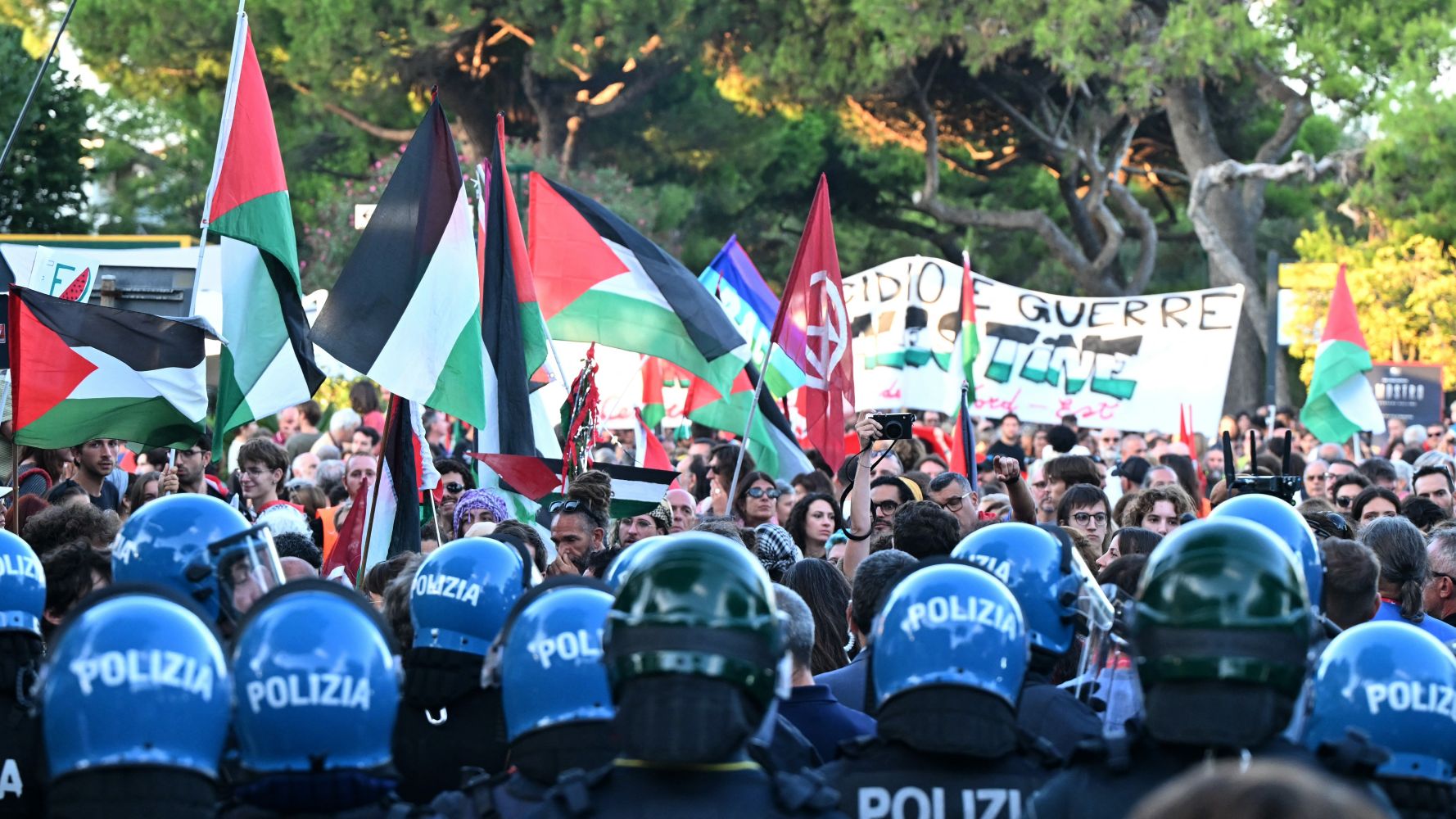 Anti-riot policemen face protesters at the end of a march in support of Gaza and Palestinian people at Venice Lido during the 82nd Venice International Film Festival, on August 30, 2025. Stefano RELLANDINI / AFP