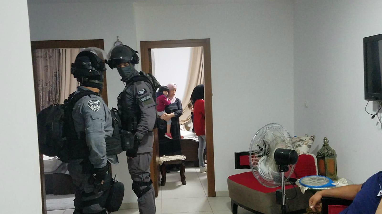 Dozens of vehicles brought helmeted security forces into the village (MEE/Anti-occupation collective)