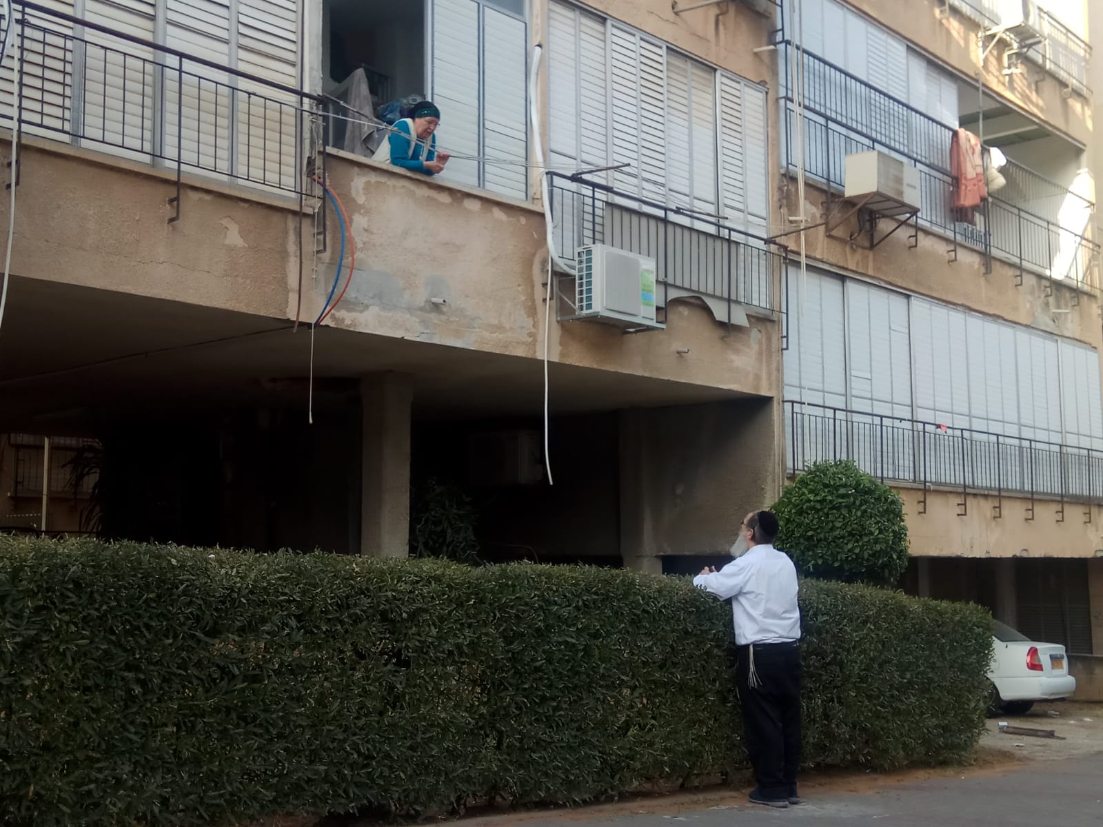 Haredi Israelis in Bnei Brak chat from a safe distance (MEE/Yisrael Frey)