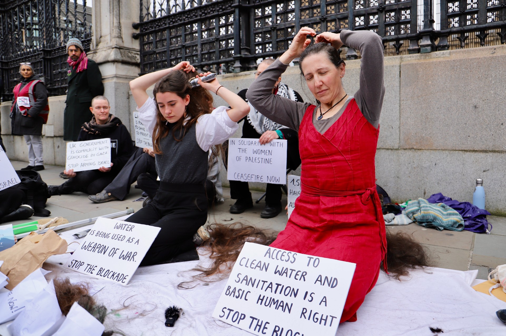 women shave hair uk parliament protest