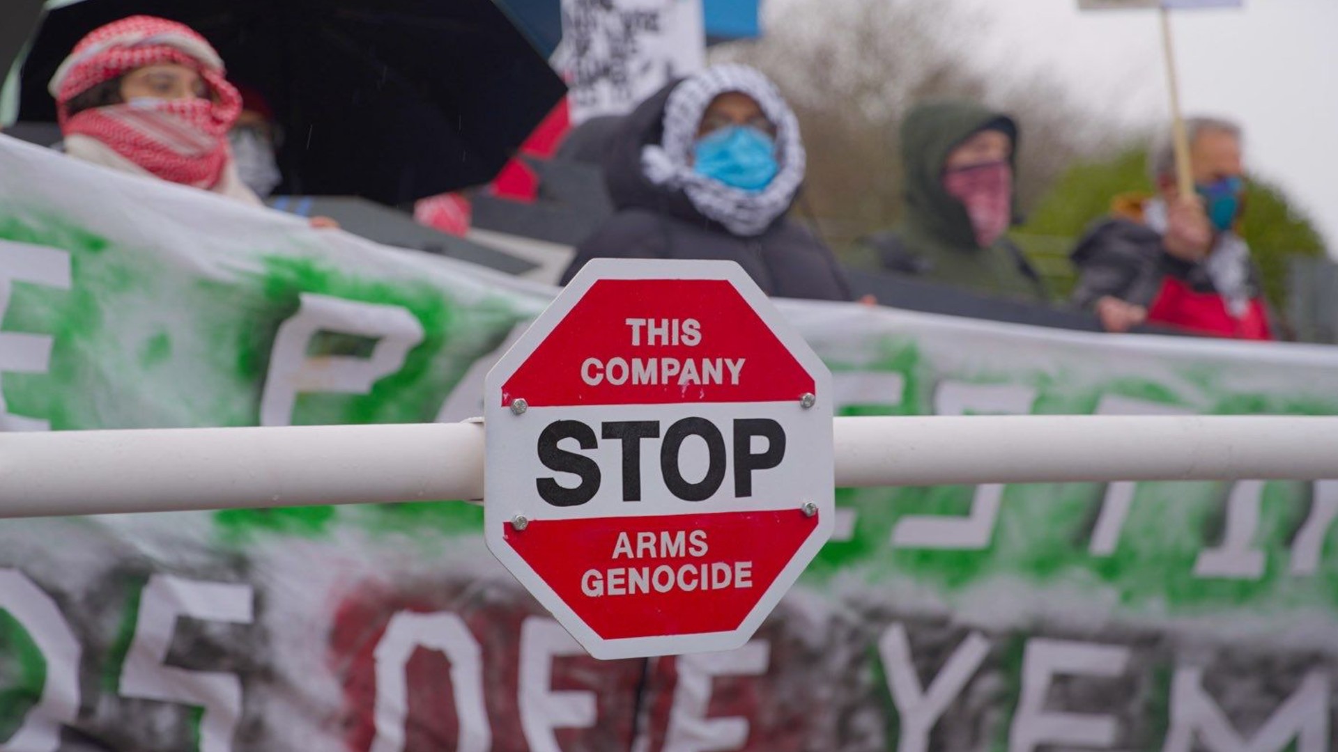 workers block factory entrance