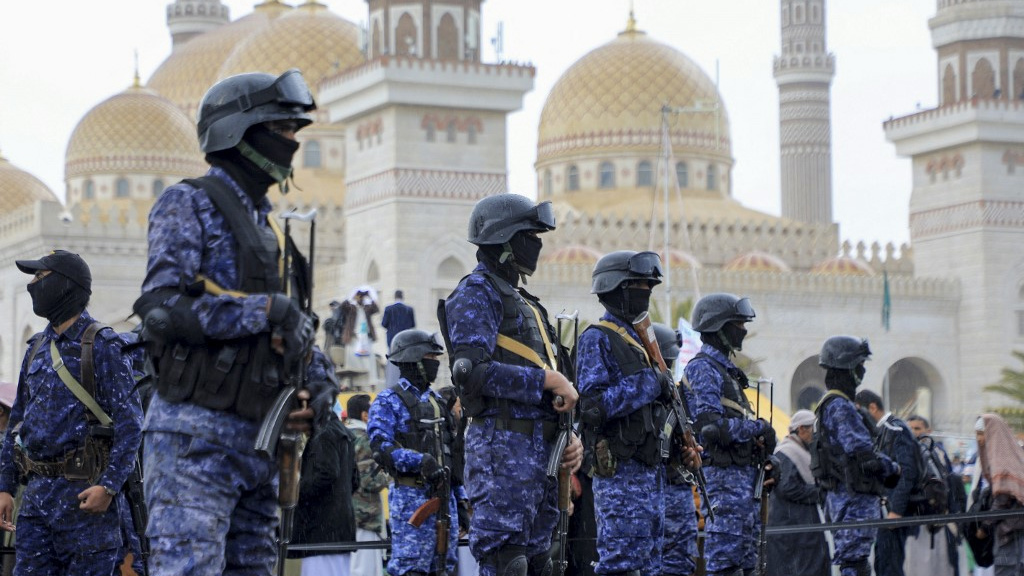 Houthi forces stand guard during an anti-Israel and anti-US rally in the Yemeni capital, Sanaa, on 19 January 2024 (Mohammed Huwais/AFP)