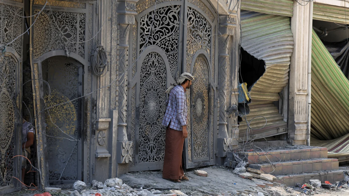 A man inspects the site of Israeli air strikes in Sanaa, on 26 September 2025 (Khaled Abdullah/Reuters)