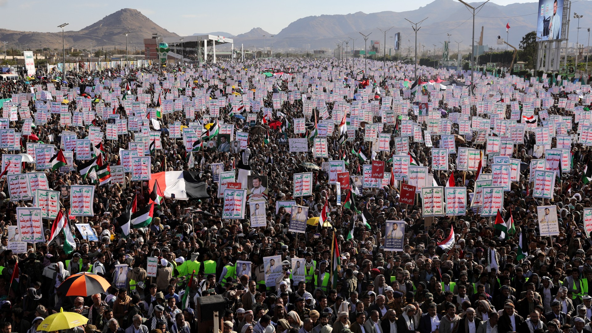 A sea of protesters waving Palestinian flags and placards in support of Yemen's Houthi rebels marched in solidarity with Palestinians in Gaza on 2 Feb 2024 (Reuters)