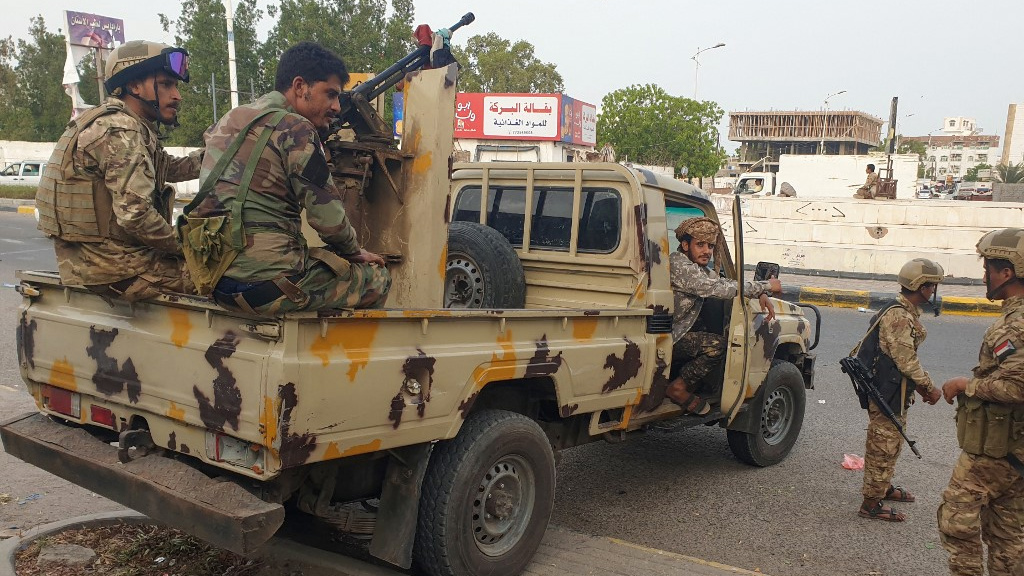 Fighters affiliated with Yemen’s separatist Southern Transitional Council deploy around the site of a reported explosion in Aden on 29 June 2022 (Saleh Obaidi/AFP)