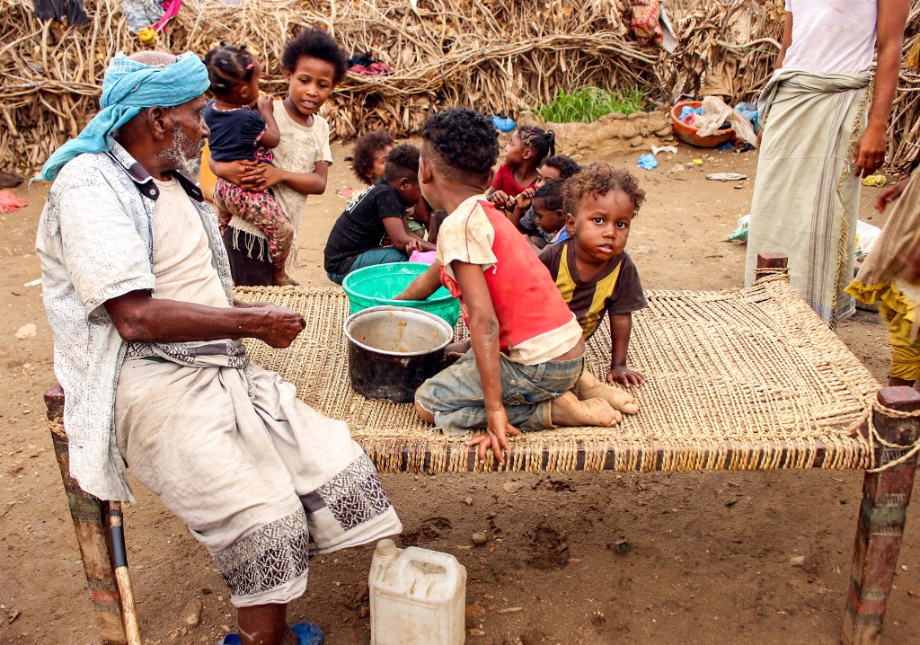 Yemenis shelter at a makeshift camp for displaced people in Hajjah province in August 2019 (AFP)