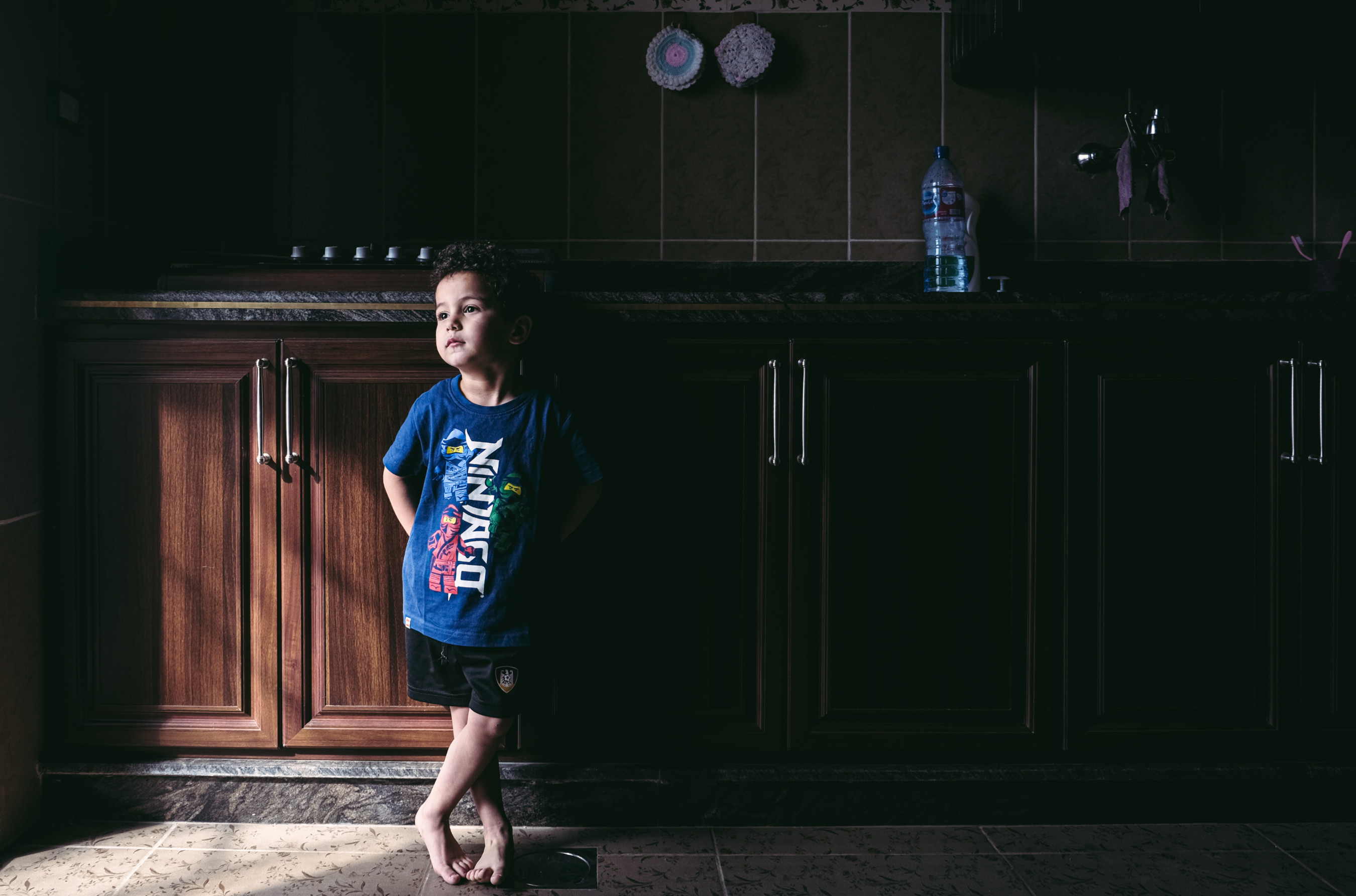 Youssif stands on the spot in the kitchen where his mother Ataa was killed by a pager's explosion (Joao Sousa/MEE)